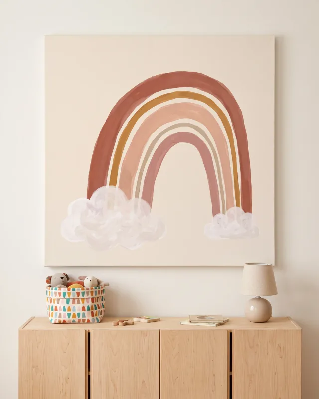 Leinwandbild – Warmer Regenbogen über weißen Wolken