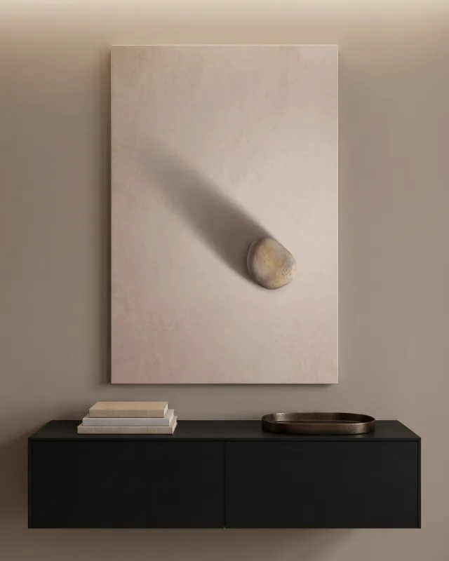 Leinwandbild – Gerundeter Stein rechts mit langem Schatten