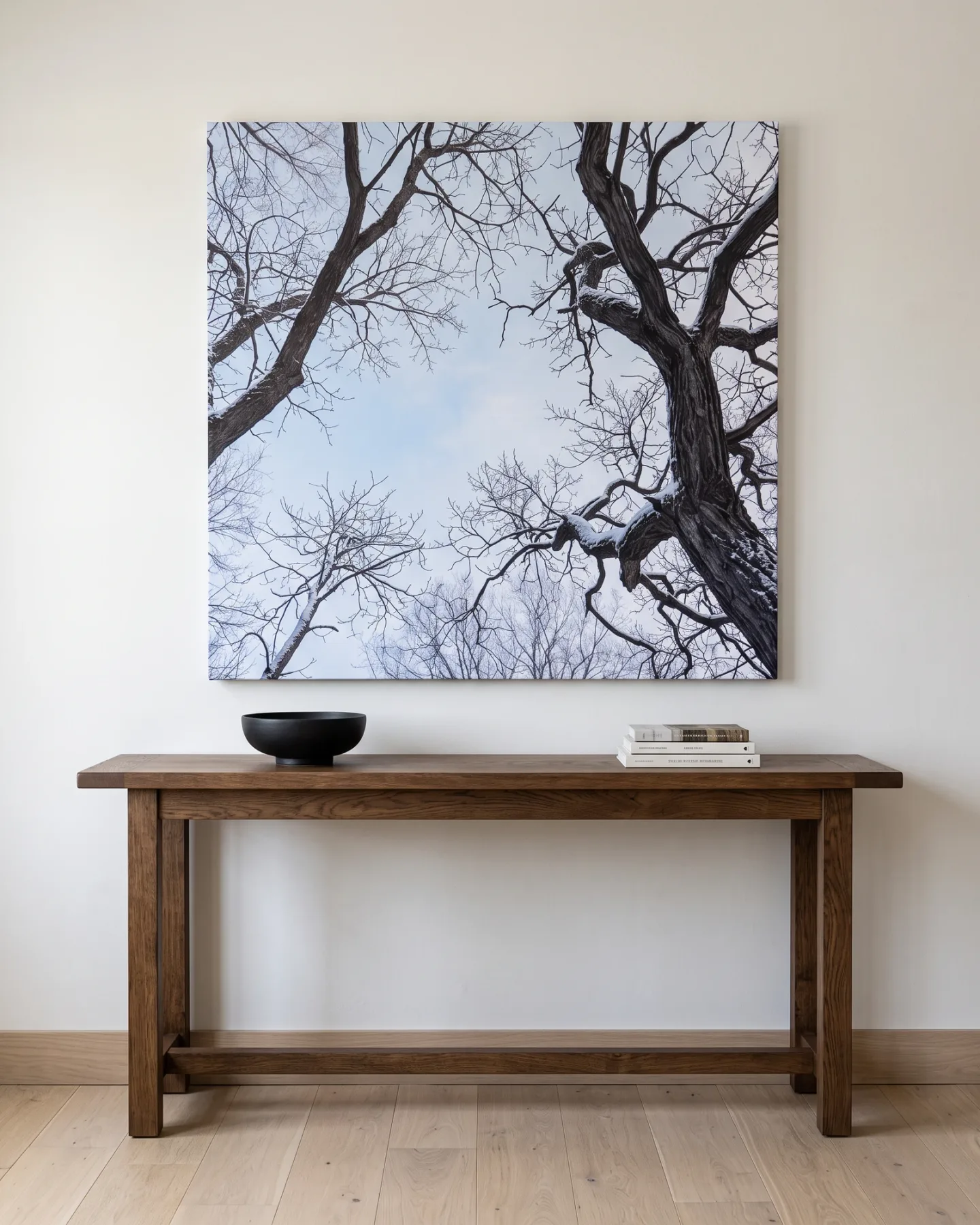 Leinwandbild – Winterliche Baumkronen unter hellem Himmel