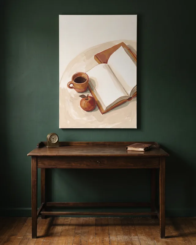 Leinwandbild – Lesepause mit Kaffeetasse und Apfel